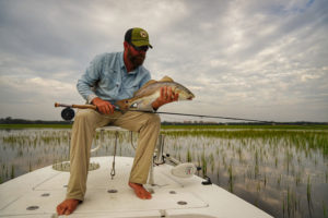Captain Mizell With a Holding Redfish Tibor Fly Reel and Fy Rod 1012